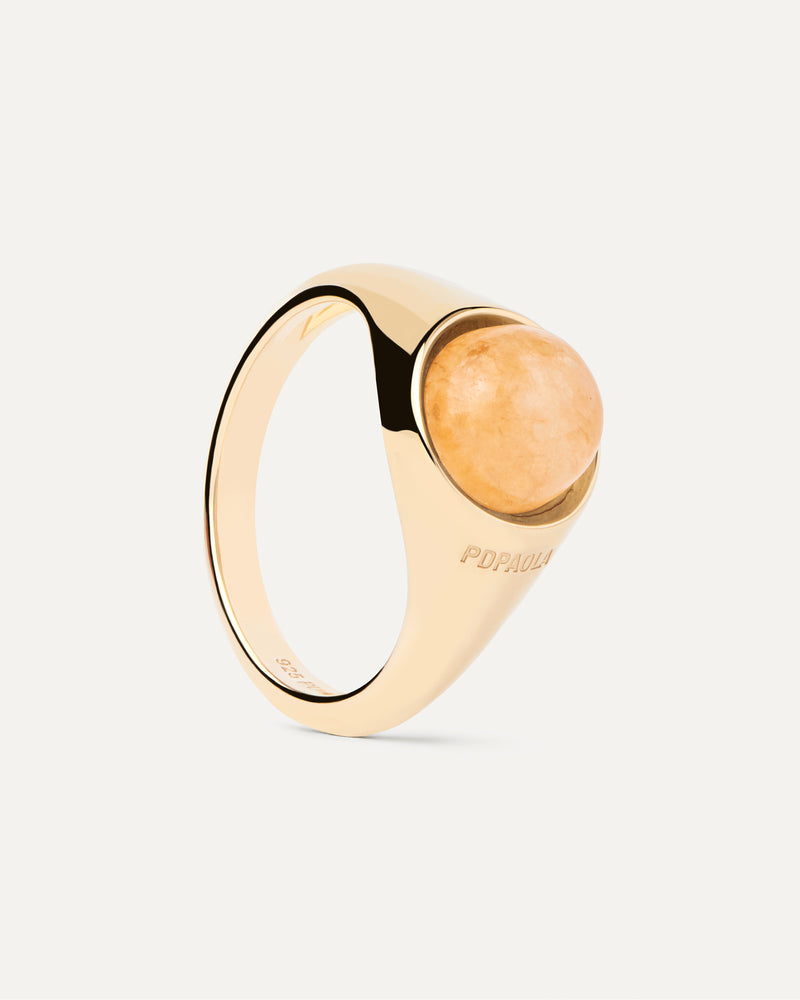 Gold-plated half sphere ring topped with an oval yellow gemstone