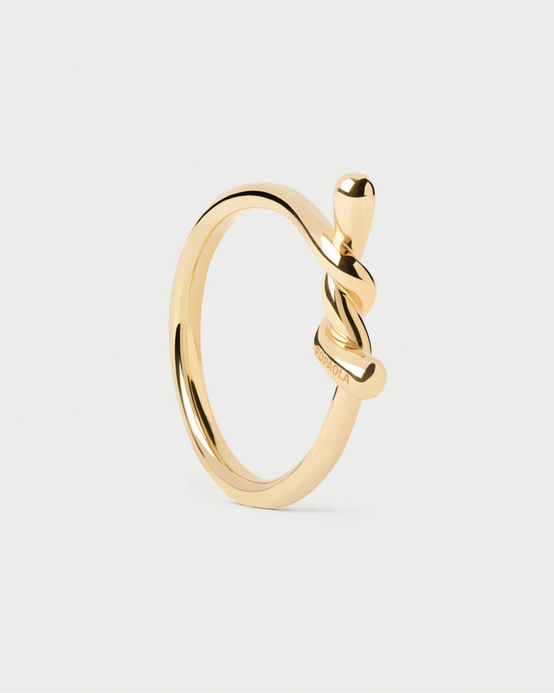 Gold-plated distinctive stacking ring featuring a fluid twisted motif
