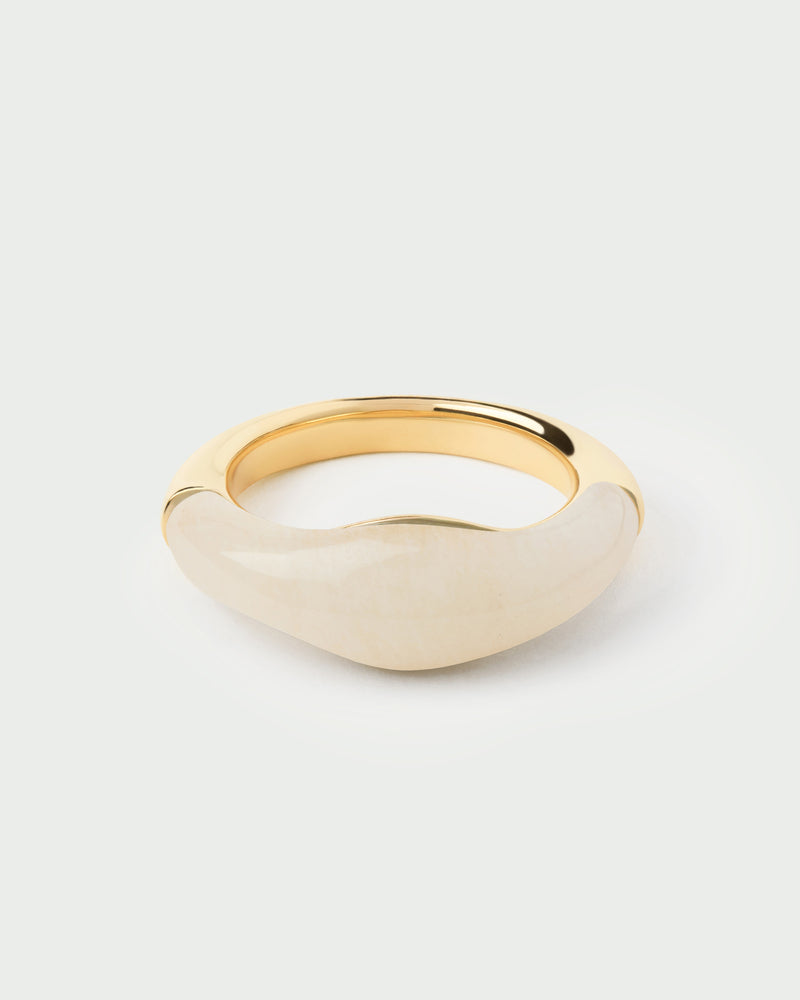 Gold-plated fluid stamp ring topped with a hand-carved white gemstone