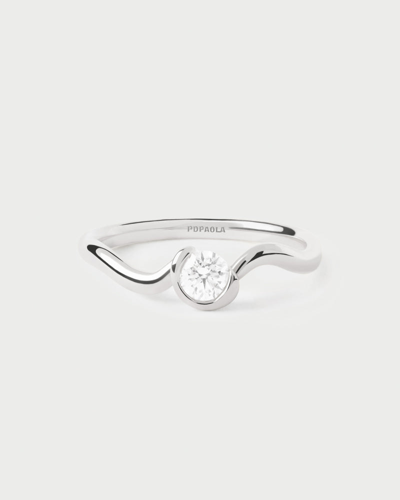 Dainty 18K white gold solitary ring featuring a lab-grown diamond and fluid lines