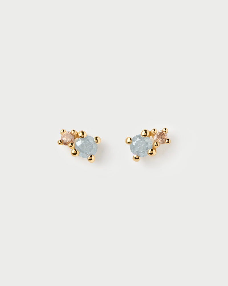 Gold-plated asymmetric two-stone round stud earrings featuring grey and brown zirconia