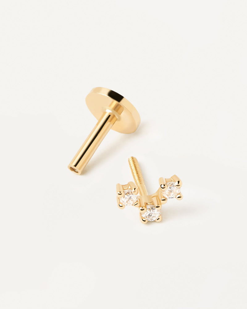 Solid yellow gold ear piercing with lab-grown diamond triangle, making 0.04 carat