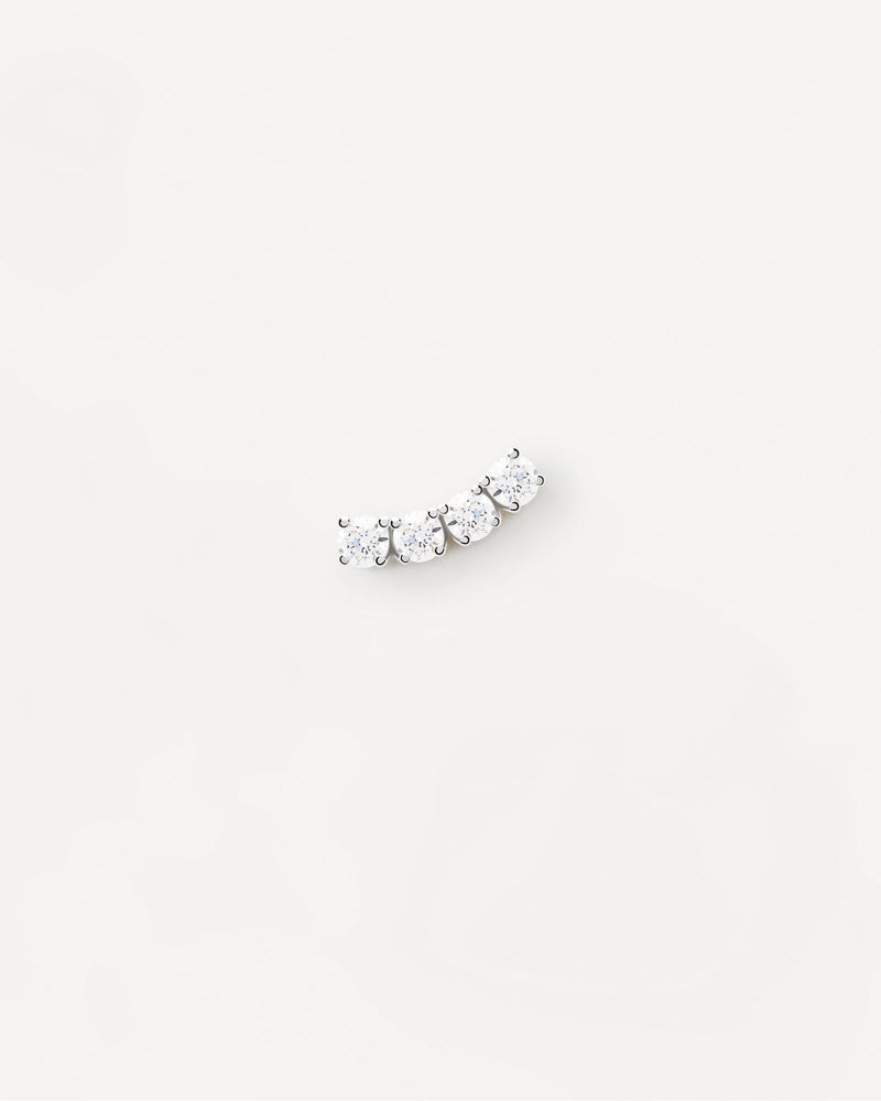 Wavy silver ear piercing with 4 white zirconia