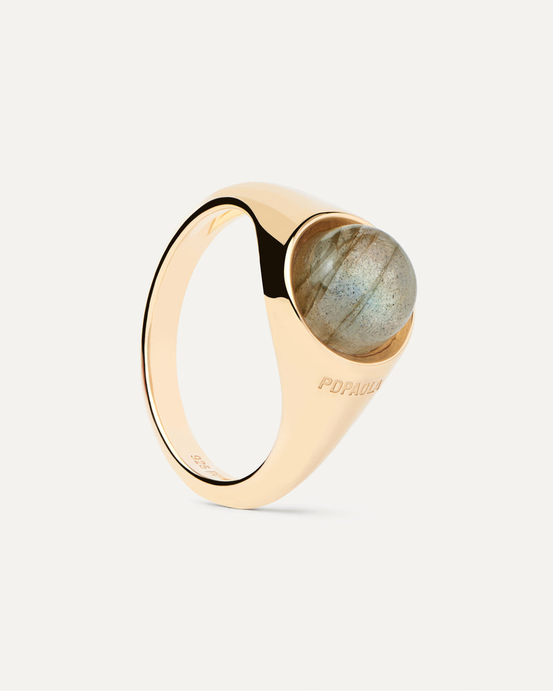 Gold-plated half sphere ring topped with an oval grey gemstone