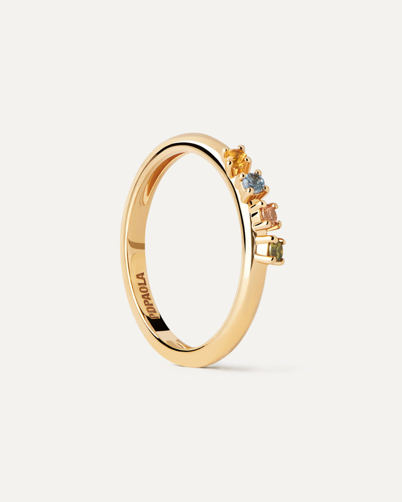 Gold-plated ring topped with a wavy set of multicolor cubic zirconias