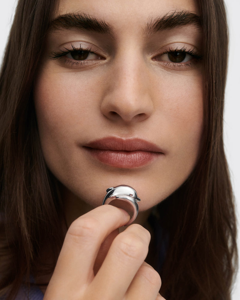 Silver modern dolphin ring with a sculptural shape
