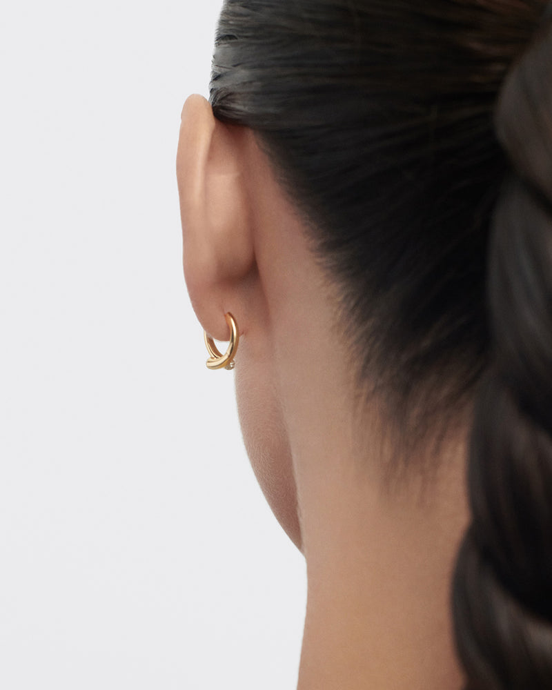 Modern hoop earrings featuring two overlapping bands set with pavé lab-grown diamonds