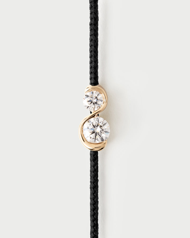 Adjustable diamond cord bracelet featuring two lab-grown diamonds