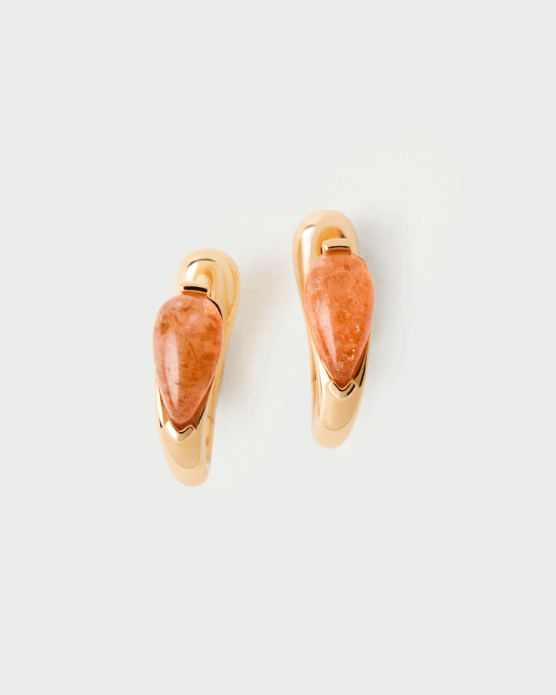 Gold-plated dainty huggie earrings accented with an oval orange gemstone